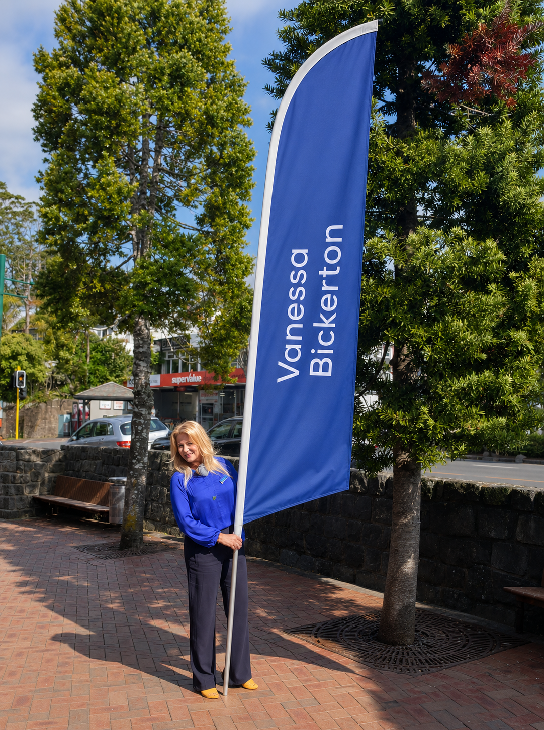 Vanessa Bickerton Auckland real estate salesperson with personalised property flag